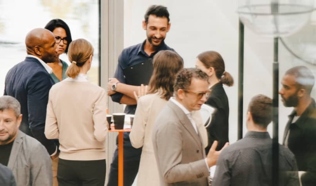 A diverse group of people at a corporate social event