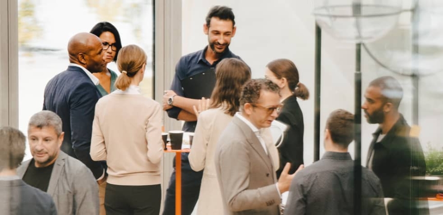 A diverse group of people at a corporate social event